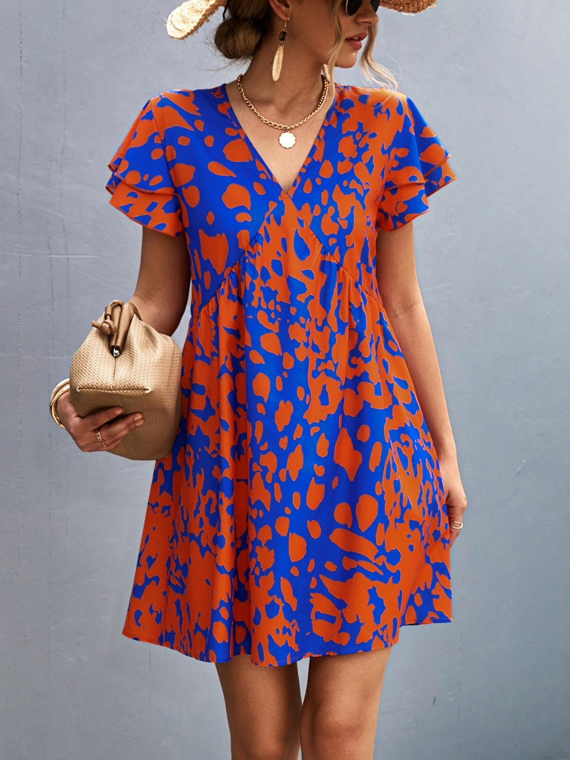 Sophie - Abstraktes Drucken Kleid mit V-Ausschnitt in Blau und Orange