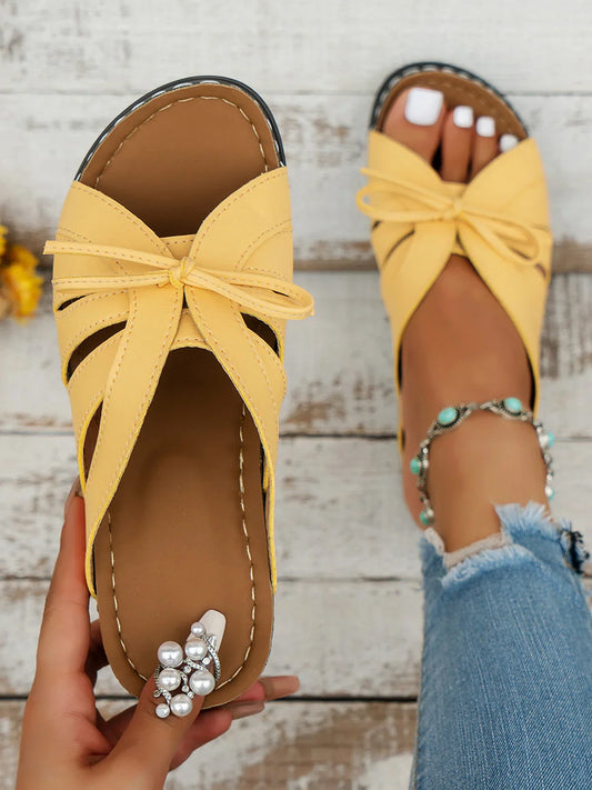 Els - Orthopädische Schlupfsandalen mit extra Abfederung in elegantem Design aus veganem Leder und Schleife auf der Vorderseite in sommerlichen Unifarben