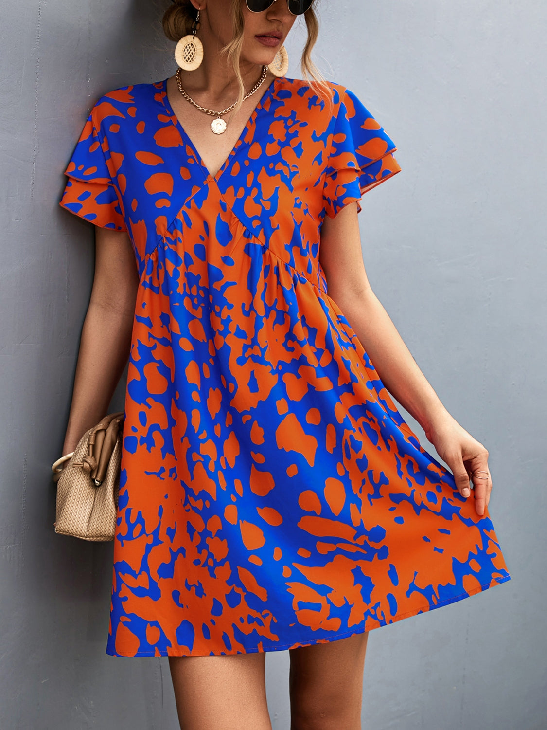 Sophie - Abstraktes Drucken Kleid mit V-Ausschnitt in Blau und Orange