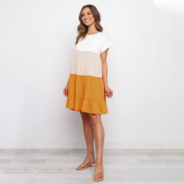 Jovita - Schattierungen des Sonnenuntergangs:  Verspieltes Kleid mit Farbblöcken in Weiß, Beige und Goldorange