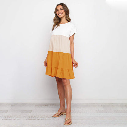 Jovita - Schattierungen des Sonnenuntergangs:  Verspieltes Kleid mit Farbblöcken in Weiß, Beige und Goldorange