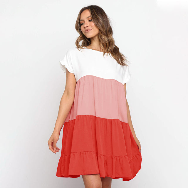 Jovita - Schattierungen des Sonnenuntergangs:  Verspieltes Kleid mit Farbblöcken in Weiß, Beige und Goldorange