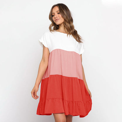 Jovita - Schattierungen des Sonnenuntergangs:  Verspieltes Kleid mit Farbblöcken in Weiß, Beige und Goldorange